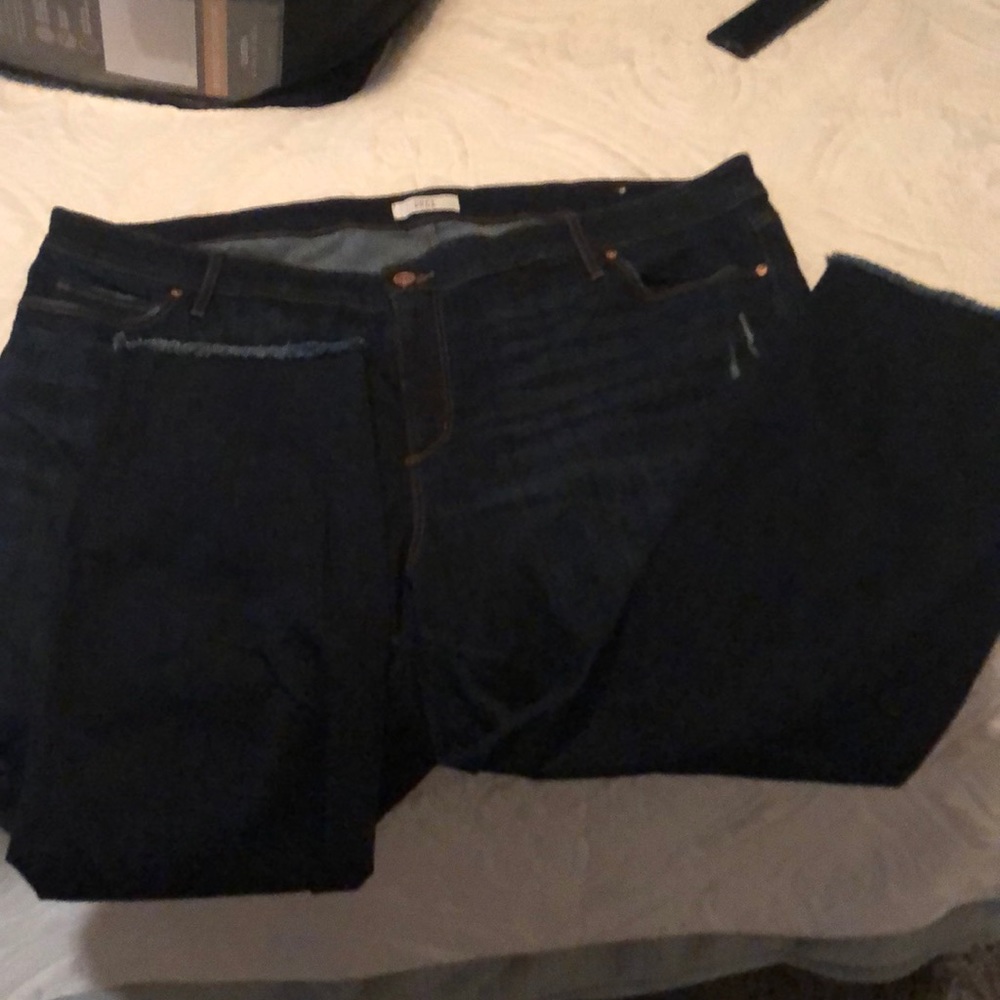 Dark wash jeans with frayed hem